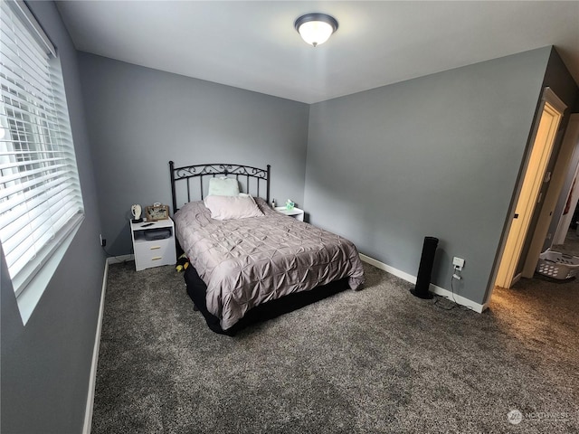 carpeted bedroom with baseboards