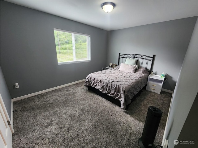 carpeted bedroom featuring baseboards