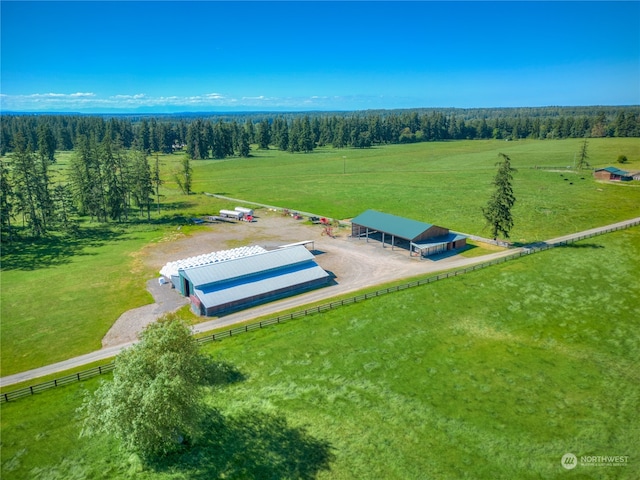 birds eye view of property with a rural view