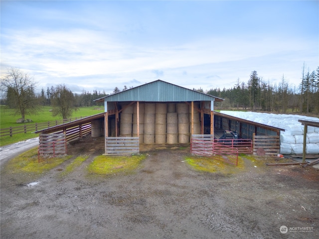 view of shed / structure featuring a rural view