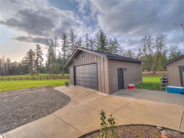 garage featuring a yard