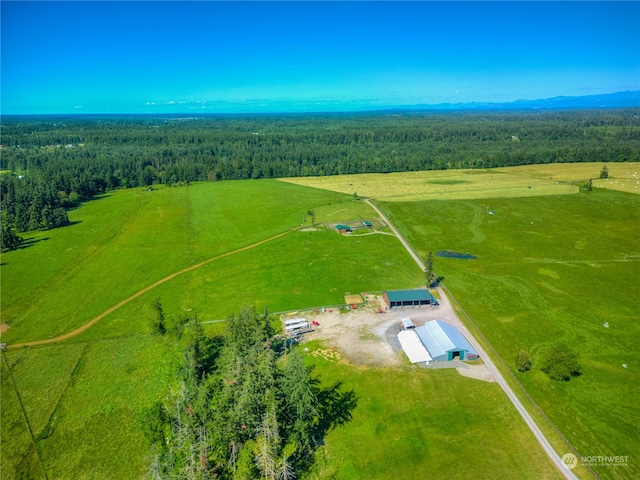 birds eye view of property featuring a rural view