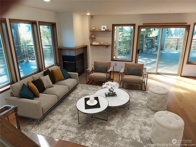 8167 Possession Ridge Ln, Clinton, WA 98236 - living room with a fireplace and light hardwood / wood-style flooring