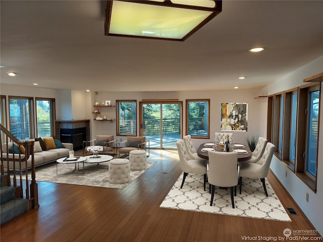 8167 Possession Ridge Ln, Clinton, WA 98236 - dining room with wood-type flooring and a fireplace