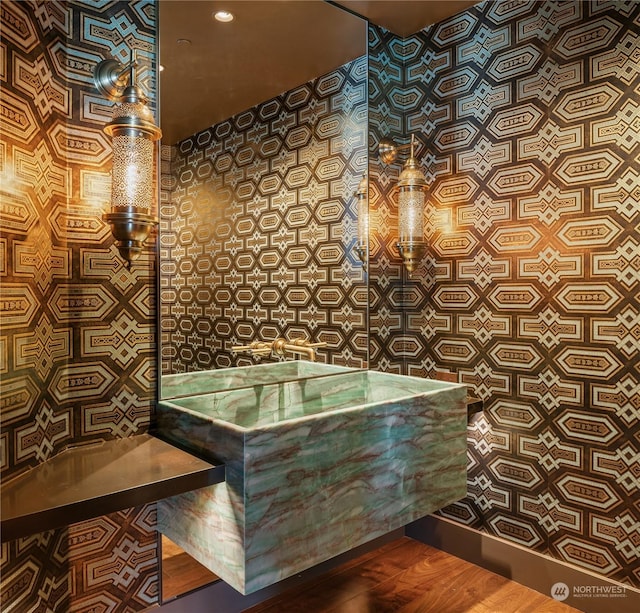 bathroom with wood-type flooring