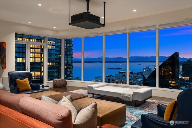 interior space with a water view and hardwood / wood-style flooring