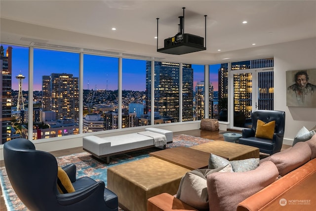 living room with hardwood / wood-style flooring and a wall of windows