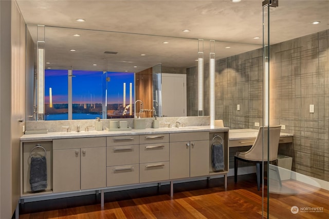 bathroom featuring a water view, vanity, and wood-type flooring