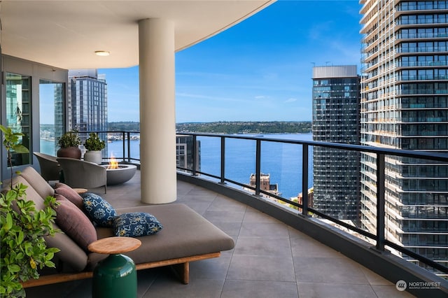 balcony featuring a water view