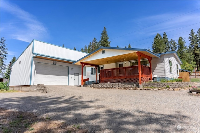 view of front of property with a porch and a garage