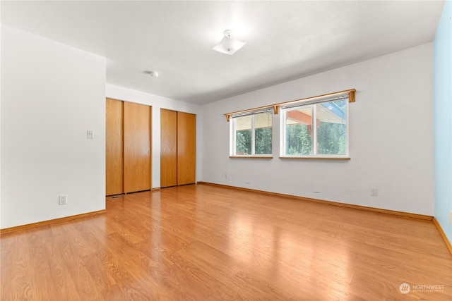 unfurnished bedroom with light hardwood / wood-style flooring