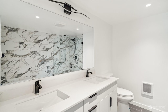 bathroom featuring walk in shower, vanity, and toilet