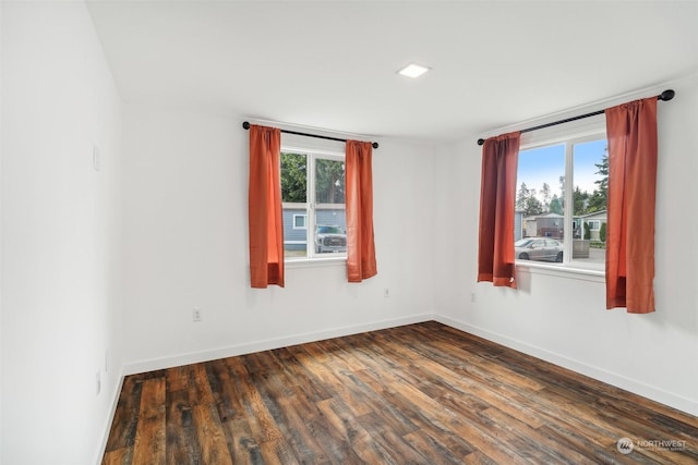 empty room featuring dark hardwood / wood-style floors