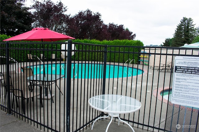 view of swimming pool featuring a patio