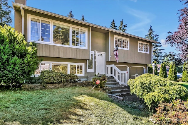 bi-level home with a front yard