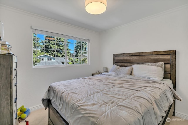 bedroom with light carpet and crown molding