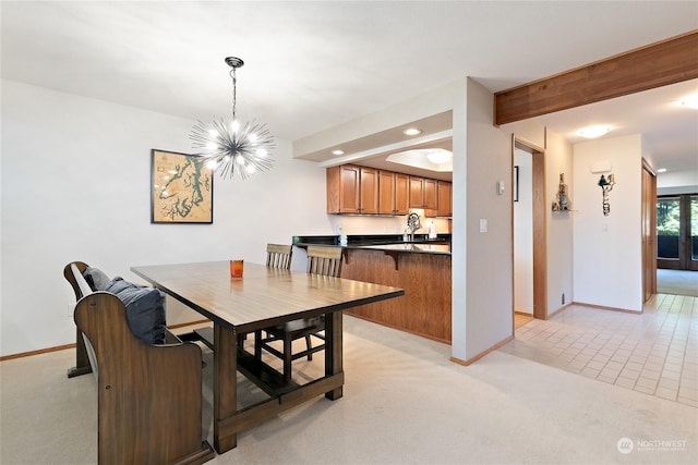 carpeted dining space with beam ceiling and a chandelier