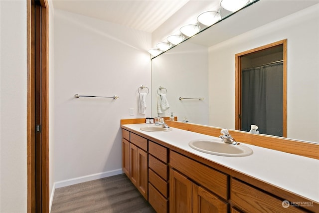 bathroom with vanity and hardwood / wood-style flooring