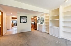 unfurnished living room with carpet