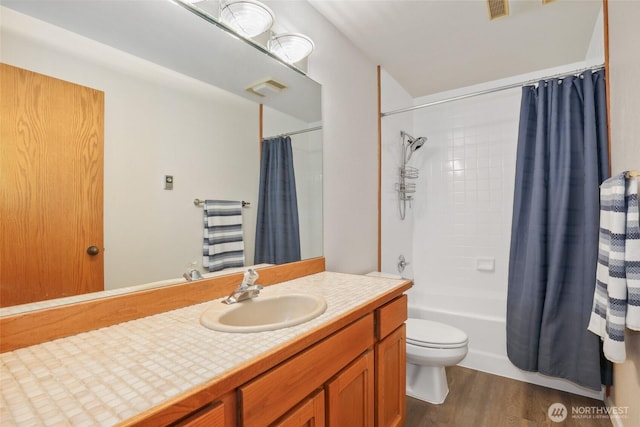 full bathroom with shower / bath combination with curtain, wood-type flooring, toilet, and vanity