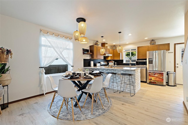 dining area with light hardwood / wood-style floors