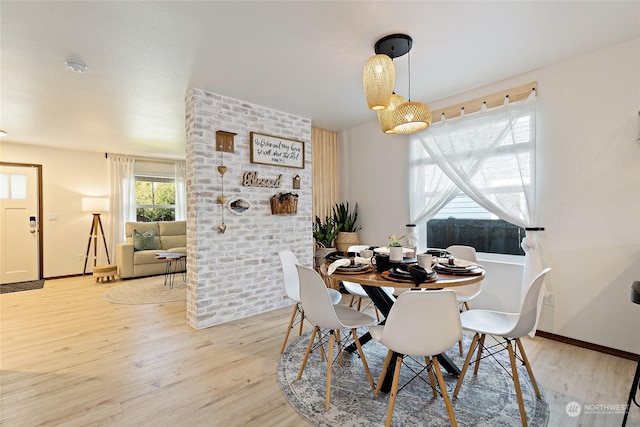 dining area with light hardwood / wood-style floors