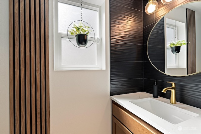 bathroom with vanity and decorative backsplash