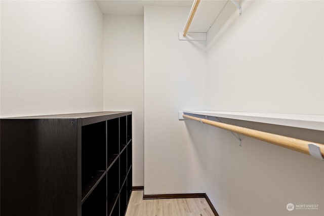 spacious closet featuring light wood-type flooring