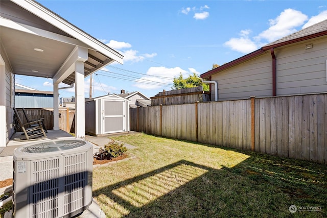 view of yard with a shed and central AC