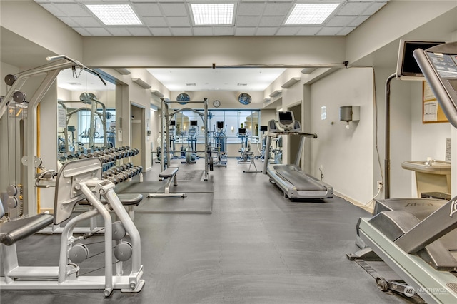 workout area featuring a drop ceiling