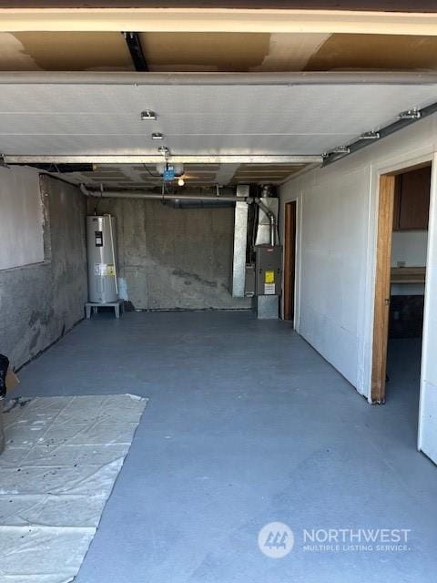 garage with heating unit and water heater