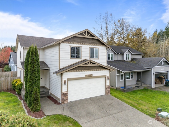 view of front of property with a front lawn and a garage