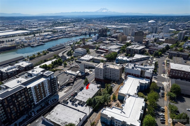 bird's eye view with a view of city and a water and mountain view