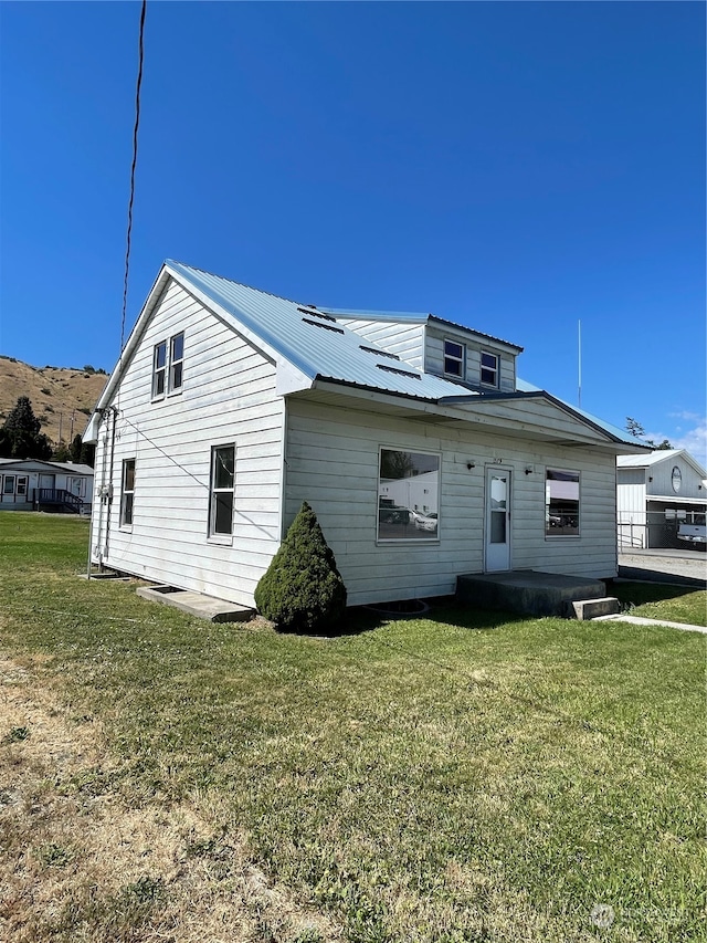 view of property exterior featuring a yard