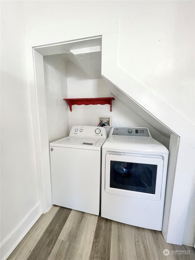 1579 2nd Ave N, Okanogan, WA 98840 - laundry room featuring washer and clothes dryer and wood finished floors