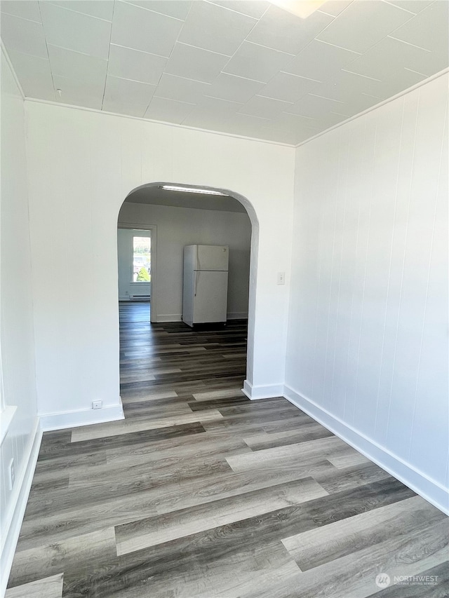 spare room featuring dark hardwood / wood-style floors