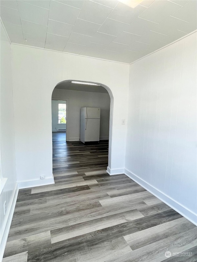 1579 2nd Ave N, Okanogan, WA 98840 - unfurnished room with arched walkways, wood finished floors, and baseboards