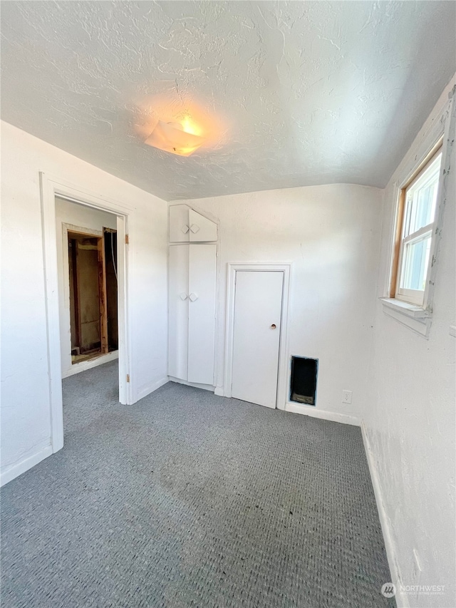 interior space featuring a textured ceiling