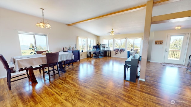 dining space featuring a healthy amount of sunlight, beamed ceiling, and hardwood / wood-style flooring