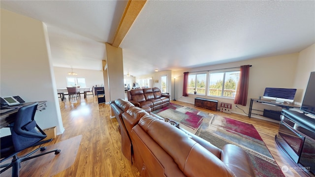 living room with hardwood / wood-style flooring and a textured ceiling