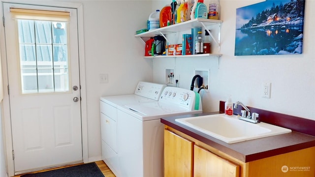 laundry room featuring separate washer and dryer, washer hookup, a wealth of natural light, and light hardwood / wood-style flooring