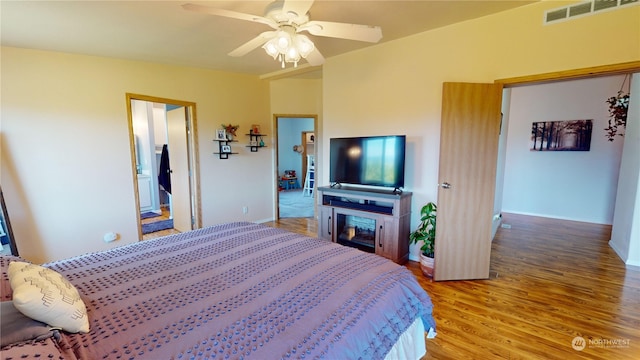 bedroom featuring ceiling fan and wood-type flooring