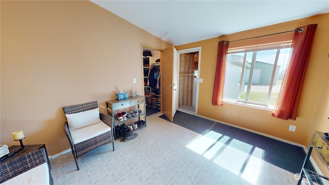 living area with vaulted ceiling and carpet floors