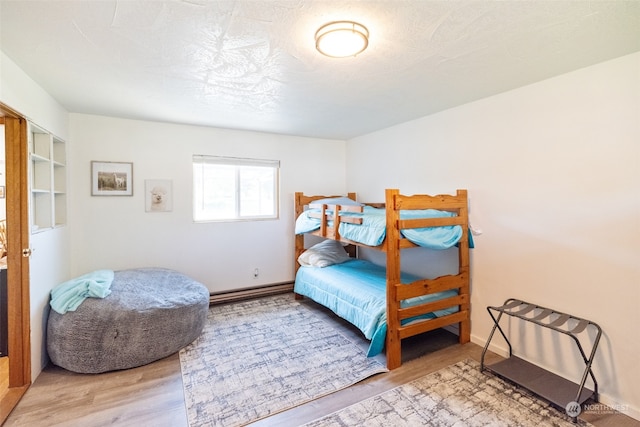 bedroom with hardwood / wood-style flooring