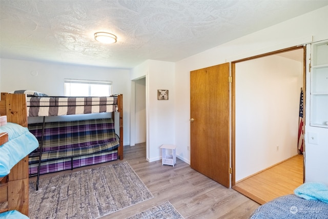 bedroom with hardwood / wood-style floors