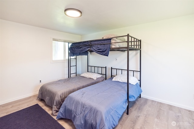 bedroom with hardwood / wood-style flooring