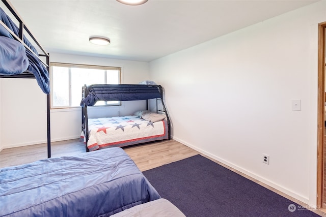 bedroom featuring hardwood / wood-style floors