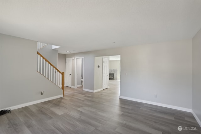 unfurnished living room with hardwood / wood-style floors