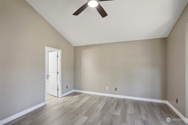 unfurnished room featuring ceiling fan, hardwood / wood-style flooring, and lofted ceiling