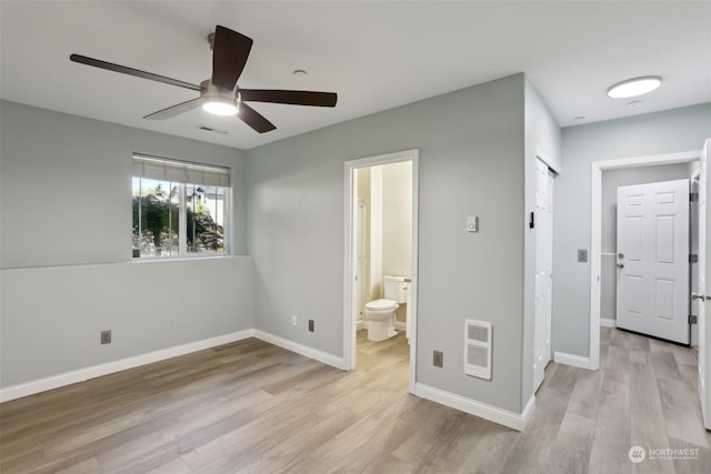 unfurnished bedroom with connected bathroom, light hardwood / wood-style flooring, and ceiling fan